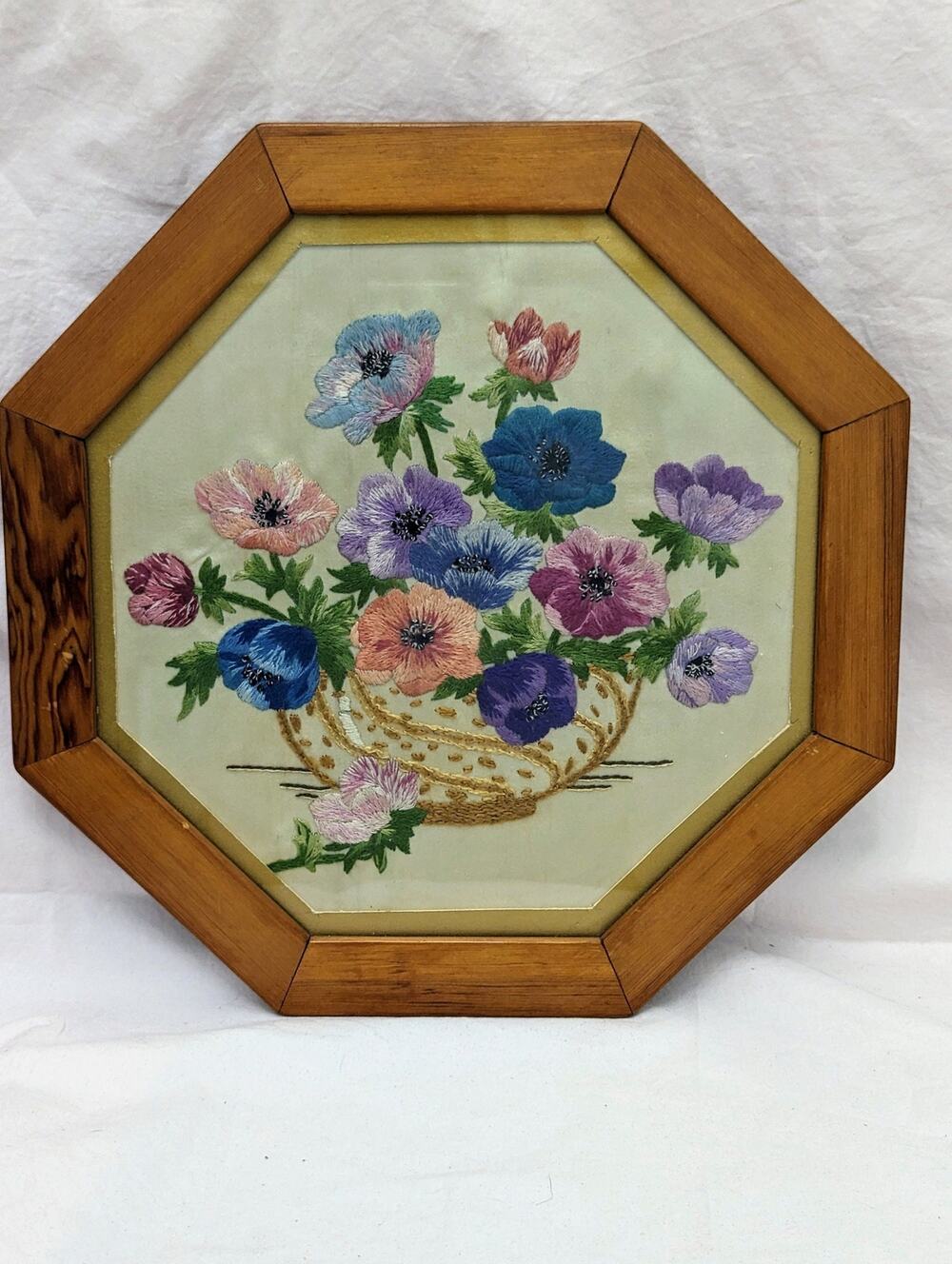 Needlepoint floral still life from Scotland over 100 years old. Octagonal frame.